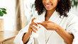 © Prostock-studio - Daily Skincare Routine. Woman Applying Cleansing Milk On Cotton Pad To Remove Makeup From Face, Free Space