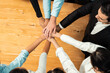 © InfiniteFlow - Multiracial business people make synergy hand stack together in meeting room as cooperation or team building for corporate employee in workplace. Habiliment