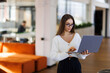 © F8  \ Suport Ukraine - Confident businesswoman working on laptop at her workplace at modern office.