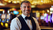 © Curioso.Photography - Smiling male casino employee in a formal vest and bow tie standing in front of slot machines.