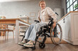 © Pixel-Shot - Young redhead woman in wheelchair at home