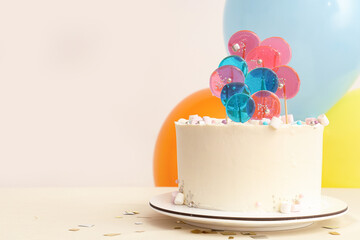 Wall Mural - cake with balloons for birthday party on table against white wall