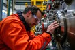 © Lakkhana - Technician adjusting a powerful hydraulic press, precision engineering