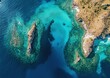 © Mbk - Aerial view of vibrant turquoise ocean lagoon, rocky islands, and coral reefs.