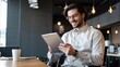 © Chenda - Happy young European business man entrepreneur work professional employee worker digital tablet fintech device sit office financial data