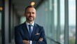 © Shams - Confident Professional Portrait: A distinguished businessman, exuding confidence and competence, poses against a modern, urban backdrop, embodying professionalism and success.