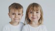 © MINA - Candid moment Average-looking kids Wonder and Joy in a minimalist studio setting,