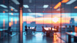© janzwolinski - Blurred modern office interior with sunset view over city skyline