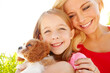© peopleimages.com - Outdoor, mom and child with dog after adoption, puppy care and bonding together with happiness. Smile, mother and girl with Cavalier pet for companion, animal and connection with space in nature
