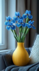 Wall Mural - blue irises in a yellow vase on a white background. International Flower Appreciation