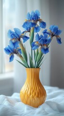 Wall Mural - blue irises in a yellow vase on a white background. International Flower Appreciation