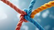 © MAY - Ropes Knotted Together Hands tying ropes together, representing collaboration, problem solving, and creating strong bonds.