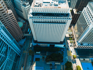 Poster - Aerial panorama of Hong Kong city showing tall buildings and streets from above. Urban landscape with architectural structures and cityscapes viewed from a high angle.