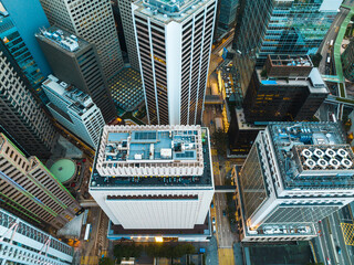 Fototapete - An aerial panorama captures Hong Kong city's impressive cityscape. Skyscrapers dominate the urban landscape in this high-angle view of the bustling metropolis.
