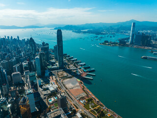 Aufkleber - Aerial panorama showcases Hong Kong city and its harbor.  A wide view captures the urban landscape and surrounding mountains from a high vantage point.
