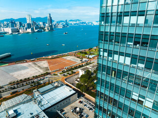 Poster - Aerial panorama of Hong Kong city showcasing a dense cityscape, harbor, and buildings from a high vantage point.