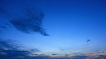 Wall Mural - A serene and captivating view of the sky at sunrise, with soft clouds painted in pastel colors, showcasing the beauty of the moment in a stunning timelapse sequence.
