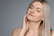 © New Africa - Portrait of beautiful woman on grey background. Space for text