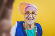 © oneinchpunch - Funny grandmother portraits. 80s style outfit. trapstar taking a selfie on colored backgrounds. Concept about seniority and old people