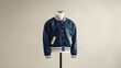 © Ameeran - A varsity jacket mockup standing upright on a mannequin against a neutral backdrop.