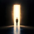 © Mr image - Pathways of Opportunity: Silhouette of a businessman poised before a luminous doorway, representing ambition and potential.