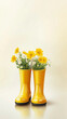 © Tetyana - Yellow rubber rain boots repurposed as rustic flower vases, displaying cheerful yellow daisies and delicate white blossoms on glossy surface, cream toned backdrop