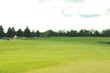 © New Africa - Blurred view of golf course on sunny day