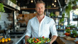 © Maksym - A chef standing in a well-lit kitchen, presenting a vibrant salad with a variety of colorful, organic vegetables, evoking the concept of clean eating and healthy, nutrient-rich mea