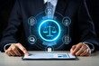 © Mobasser - Lawyer using a tablet with scales of justice hologram, symbolizing legal services, technology integration in law practice, digital legal consulting