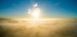 © Austockphoto - Golden sunrise over landscape of fog and mist