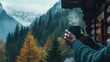 © peerawat - A person drinking coffee by a mountain cabin, enjoying the peaceful morning