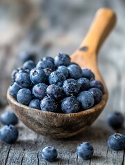 Poster - A wooden spoon filled with vibrant blueberries on a rustic wooden surface depicting freshness : Generative AI