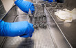 © Senalfred - Nurse Cleaning and Arranging Medical Surgical Instrument for Washing and Reprocessing