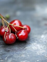 Poster - Fresh and Juicy Red Cherries on a Rustic Stone Surface Ideal for Healthy Food Photography : Generative AI