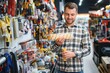 © Serhii - Portrait of mature man standing in hardware store