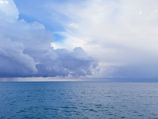Wall Mural - cloudy sky over ocean before rain