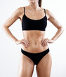© nenetus - Beautiful woman with sporty body posing over white background.