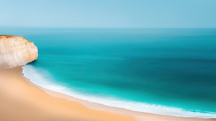 Wall Mural - a vast expanse of water adjoins a sandy shore, with a towering cliff overhead and an azure sky above