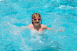 © Volodymyr - Children playing in the swimming pool. Summer kids vacation, boy swim in pool. Summer activity.
