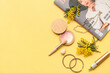 © Pixel-Shot - Decorative cosmetics with stylish jewelry, magazine and mimosa flowers on yellow background