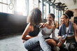 © peopleimages.com - Conversation, gym and women on floor, break and relax with fitness, gossip and exercise. People, friends and wellness facility for training, resting and discussion for progress and support with goals