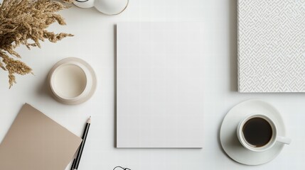 Wall Mural - blank canvas: a minimalist workspace setup, with a blank paper as the focal point, surrounded by a c