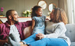© peopleimages.com - Happy family, relax and bonding with child on sofa for holiday, weekend or comfort at home. Dad, mom or little girl with smile for childhood, parenting or break together on living room couch at house
