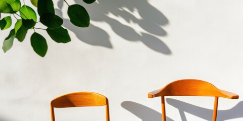 Aufkleber - Minimalist Biophilic Design Sunlit Wooden Chairs with Organic Shadows and Green Foliage - Contemporary Workspace Inspiration for Mindful Productivity