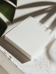 Poster - stack of textured white paper sits on concrete surface, with shadows of leaves creating natural pattern. minimalist design emphasizes simplicity and elegance