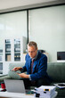 © laddawan - Mature businessman working in office with laptop, tablet, and notes. Perfect for business, finance, accounting