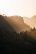 © Travel 'n' Lifestyle - View of serene sunrise over majestic mountains and tranquil forest with light rays, Mirador de La Cumbrecita, Santa Cruz de la Palma, Spain.