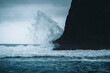 © Travel 'n' Lifestyle - View of dramatic waves crashing on a black sand beach with rocky cliffs under an overcast sky, Playa de Benijo, Santa Cruz de Tenerife, Spain.