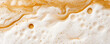 © Anucha - A close-up view of creamy foam and rich caramel swirls, reminiscent of a delicious beverage, creating an inviting and indulgent visual experience.