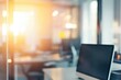 © gankevstock - Blurred bright open-plan tech workspace with glowing screens in blurred focus